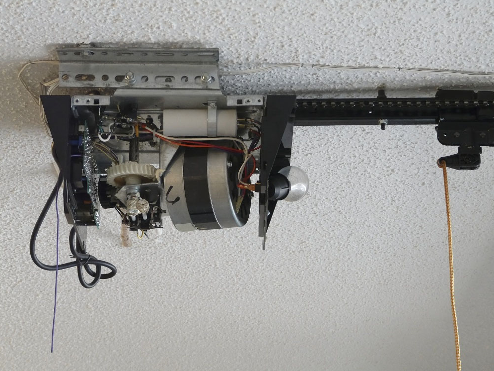 Garage door opener getting repair by experts in Sarasota, FL.