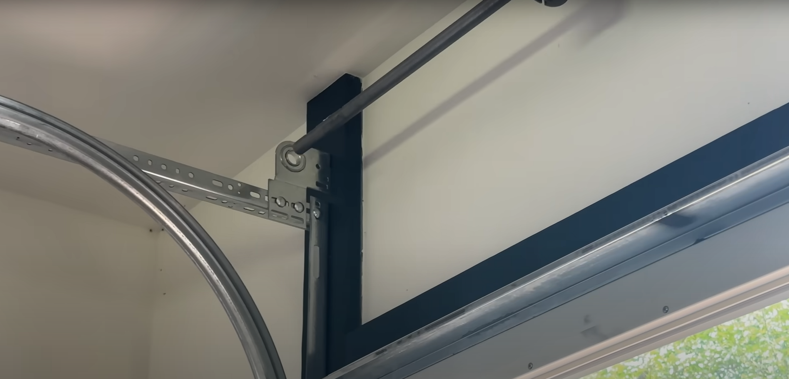 Garage door track repair service for smooth and safe door operation